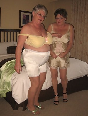 Those two sexy sirens are at it again, wearing their hot sexy girdles and lingerie.