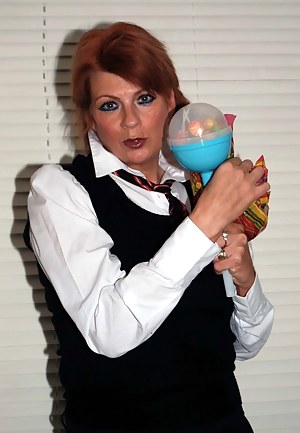 Dressed as a schoolgirl sucking my lolly pop and flashing my white panties.